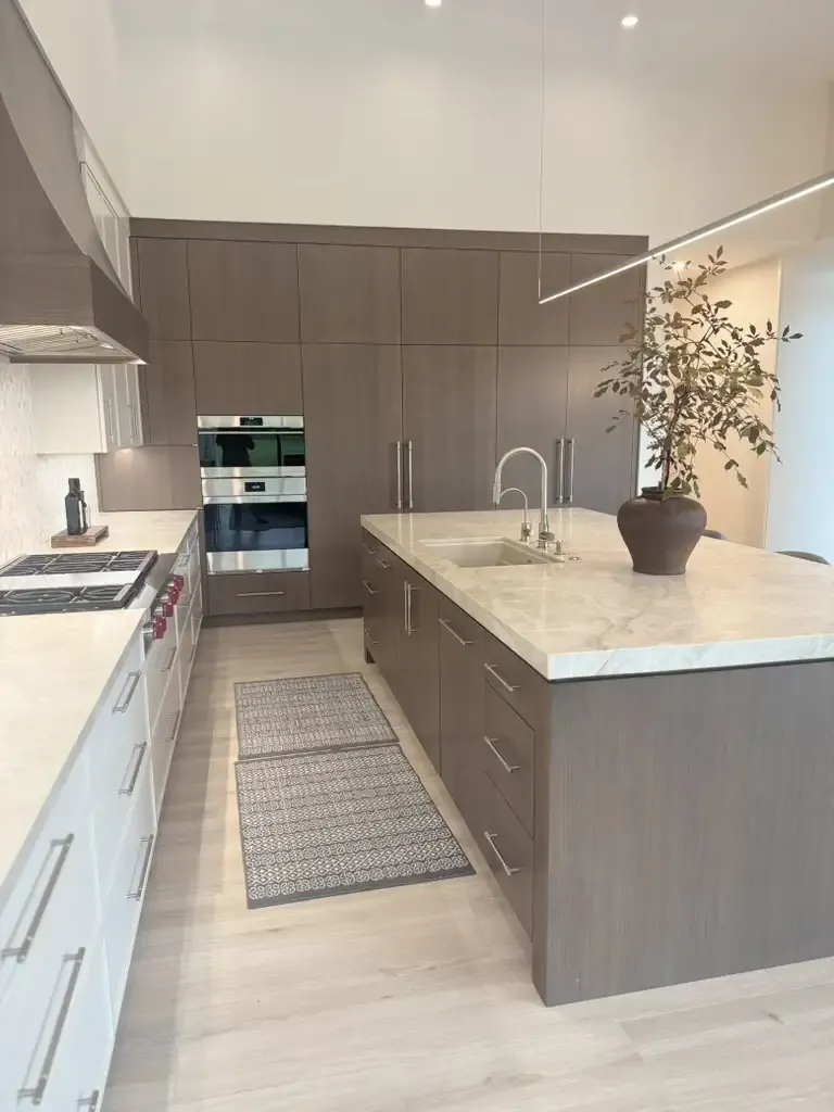 Sleek minimalist kitchen design by Kitchen & Bath Studios Inc.