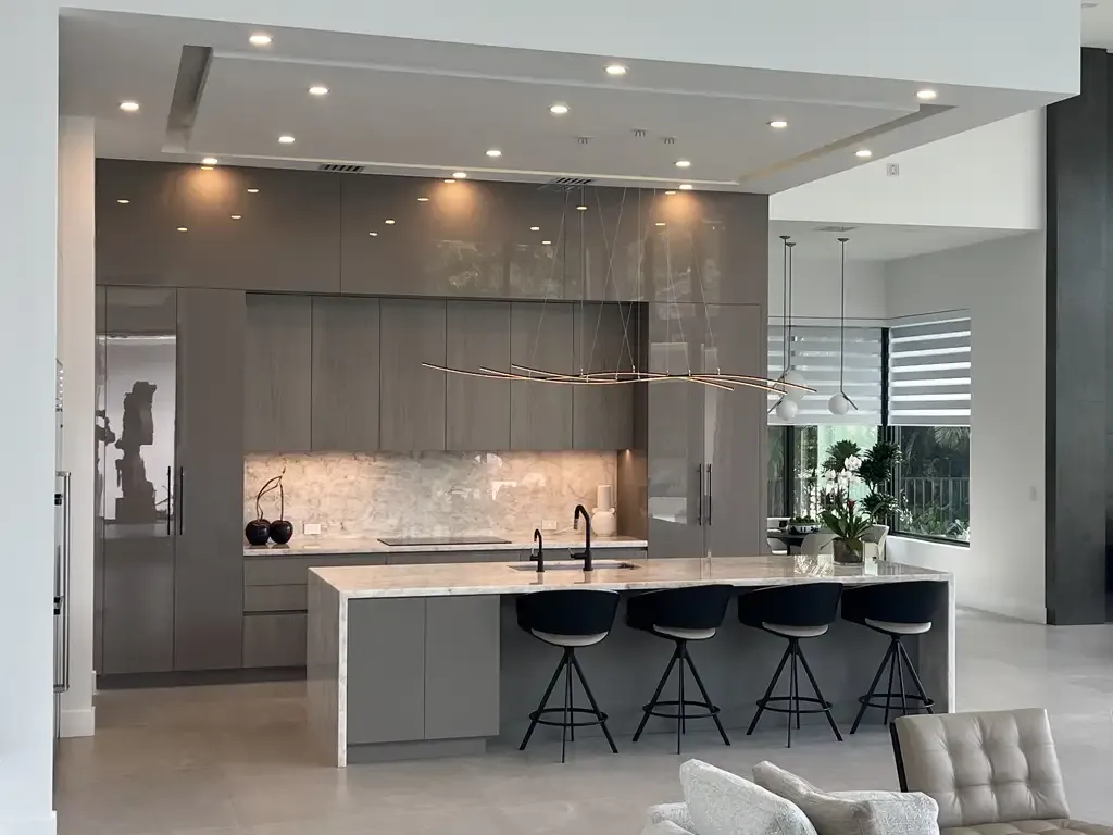 High gloss modern grey kitchen cabinetry design by Kitchen & Bath Studios Inc.