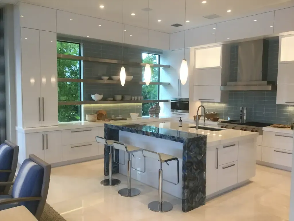 Modern kitchen with blue agate waterfall island by Kitchen & Bath Studios Inc.