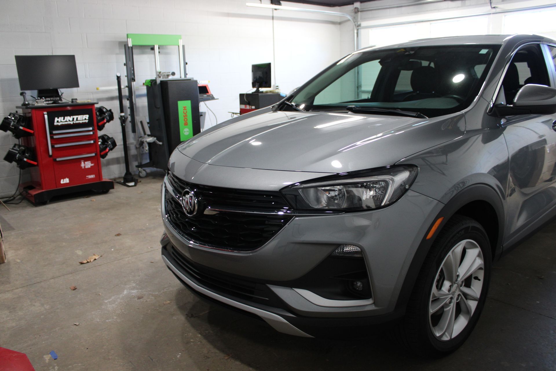 Vehicle on calibration floor with surround-view calibration targets on all sides