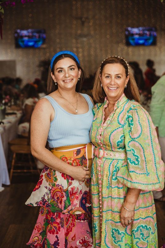 Two women are posing for a picture together in the Aberfeldy Barn.
