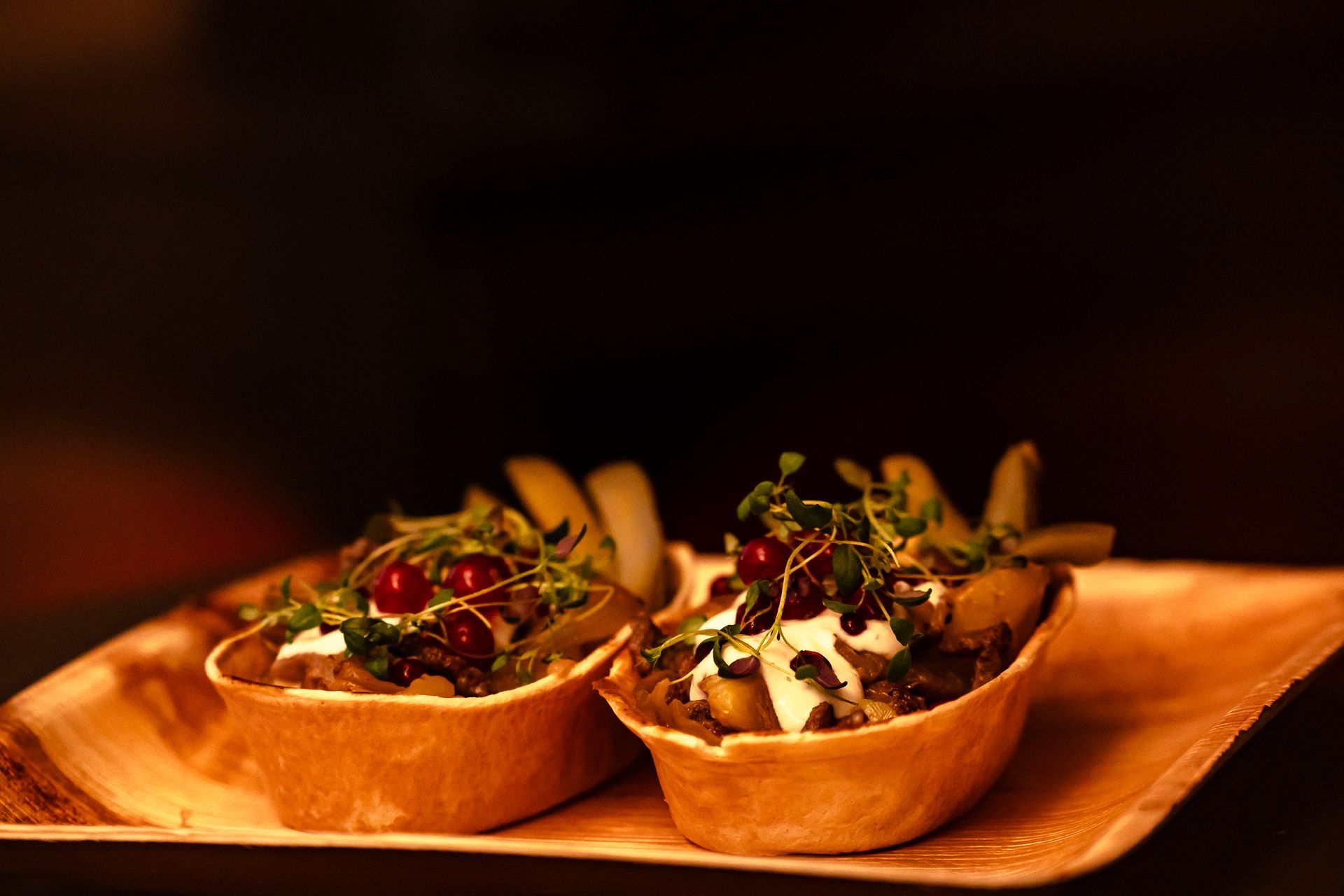 Signature potato boat filled with reindeer meat, potato and lingonberries.