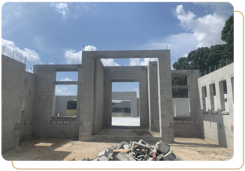 fully built CMU block house walls under a blue sky - concrete masonry unit block walls