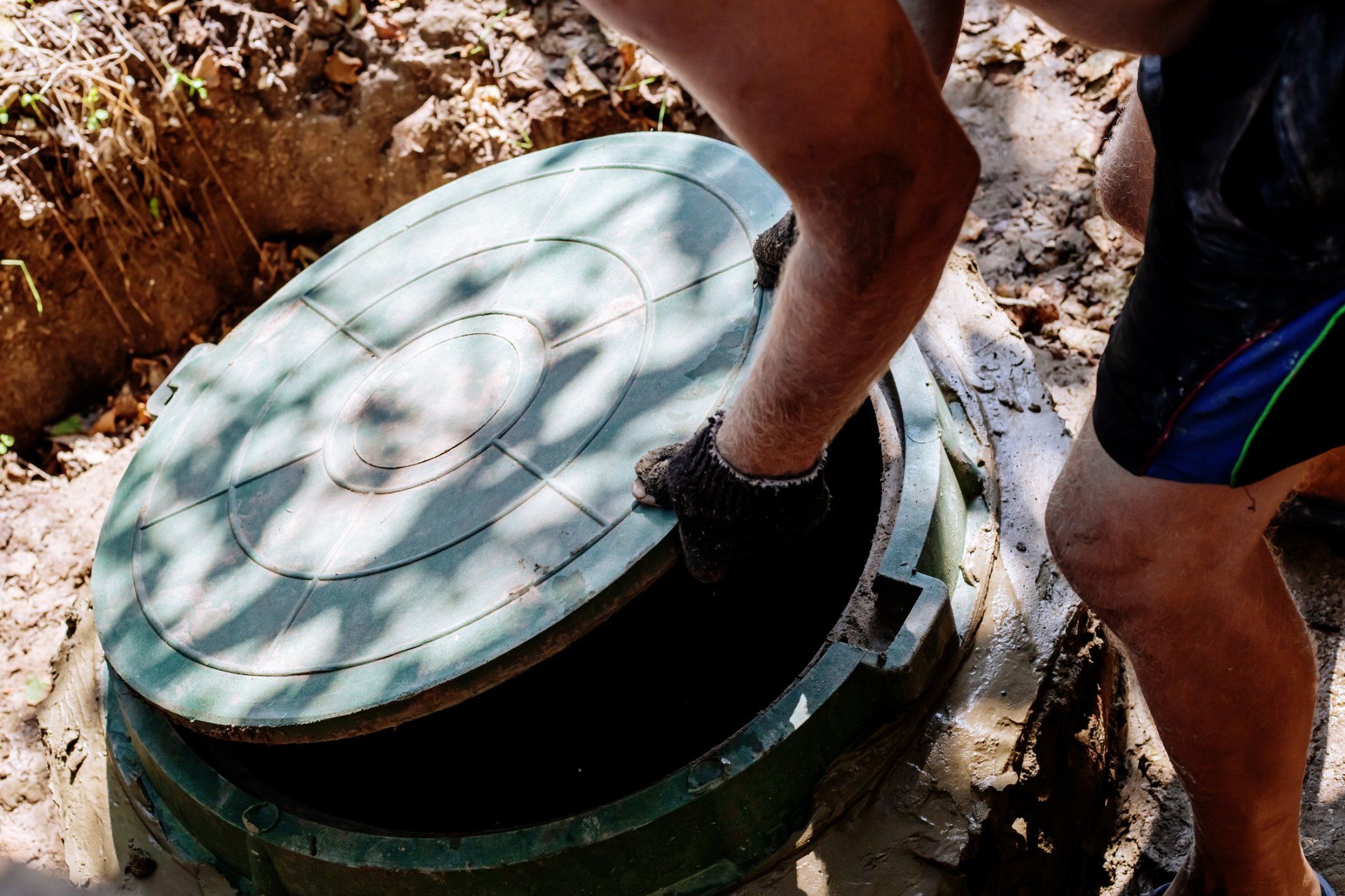 Man Opens the Sewer Hatch – Blountville, TN – Blountville Septic Tank Service