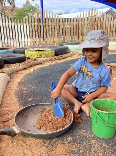 A Child Playing With Sand In a Park — Gap Community Early Learning Centre In The Gap, NT