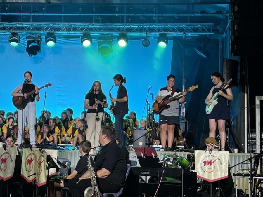 A group of people are playing instruments on a stage.