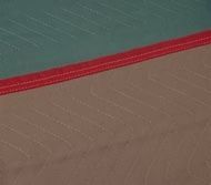 Teal and brown fabric with red trim; stitched pattern.