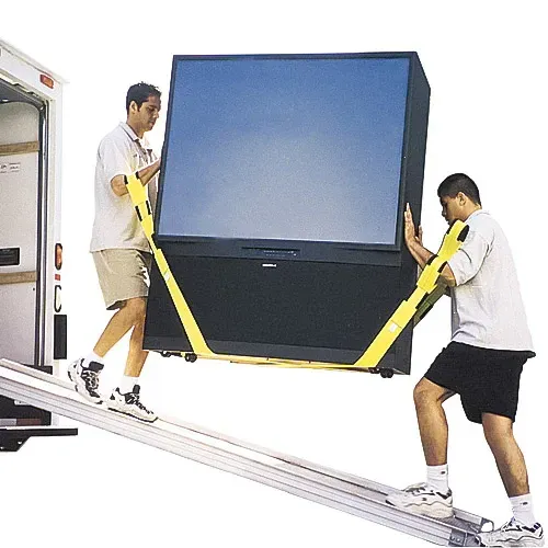 Two people using straps to carry a large TV down a ramp into a truck.