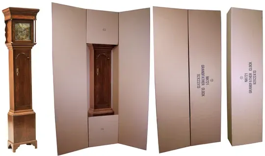 Grandfather clock being packaged in custom cardboard for moving.