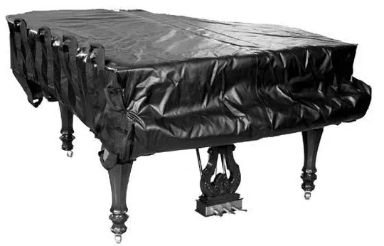 Black piano covered with a black fabric cover.