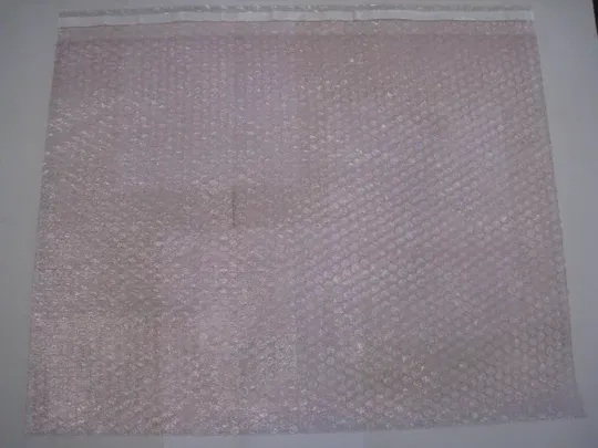 Clear bubble wrap bag with a white adhesive strip at the top.