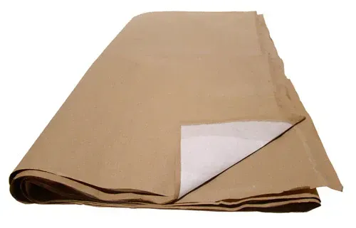 Tan and white tarp folded, with brown edging.