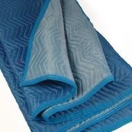 Blue and gray moving blanket with zigzag stitching.