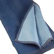 Blue moving blanket with light blue interior, folded, angled chevron stitching.