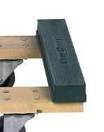 Black rubber furniture stop blocks a wood cart wheel.