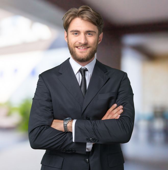 Smiling Business Man in Charcoal Suit and Crossed Arms — New Park Suit Hire & Menswear in Hermit Park, QLD