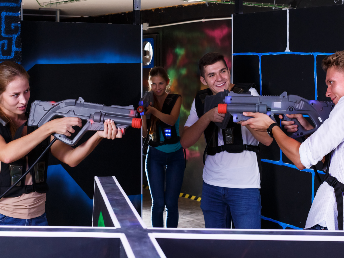 A group of friends are playing a game of laser tag