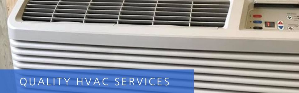 Blue and white HVAC unit with a “QUALITY HVAC SERVICES” sign on the front