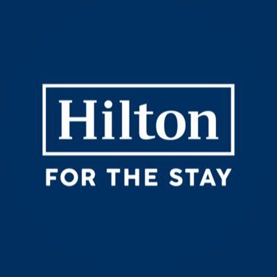 Hilton logo on a blue background with the words “FOR THE STAY”