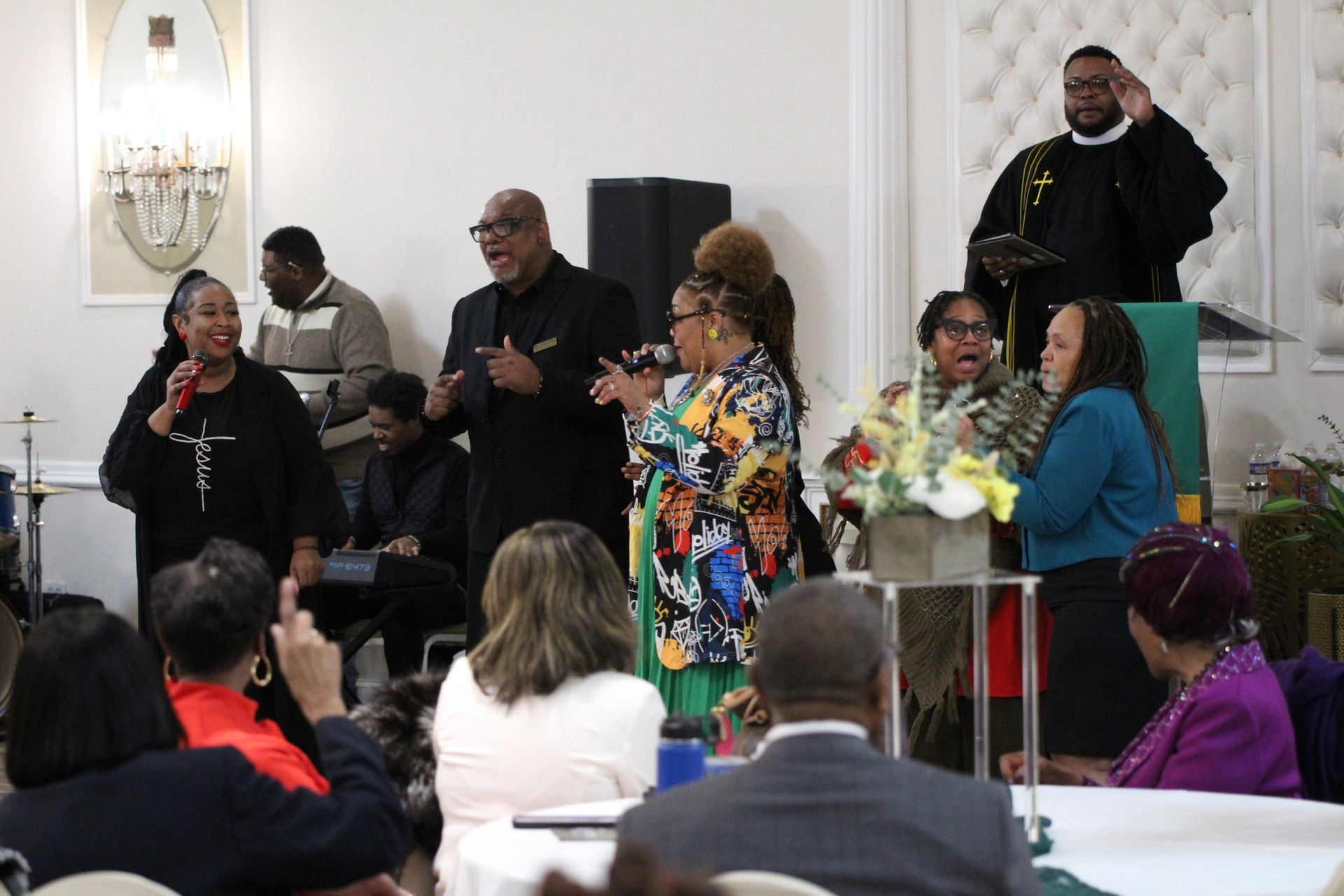 A group of people are singing in a church.