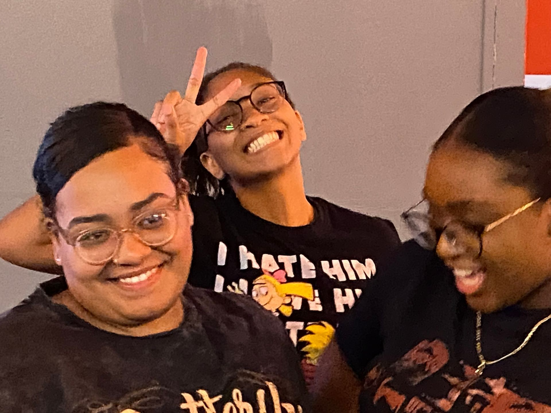 3 youths smiling
