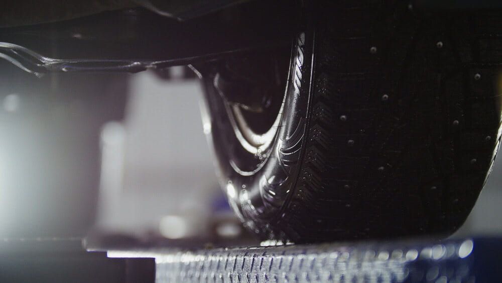 A Close Up Of A Car Tire Being Washed In A Garage — Dore's Goodyear Autocare Tully In Cardwell, QLD
