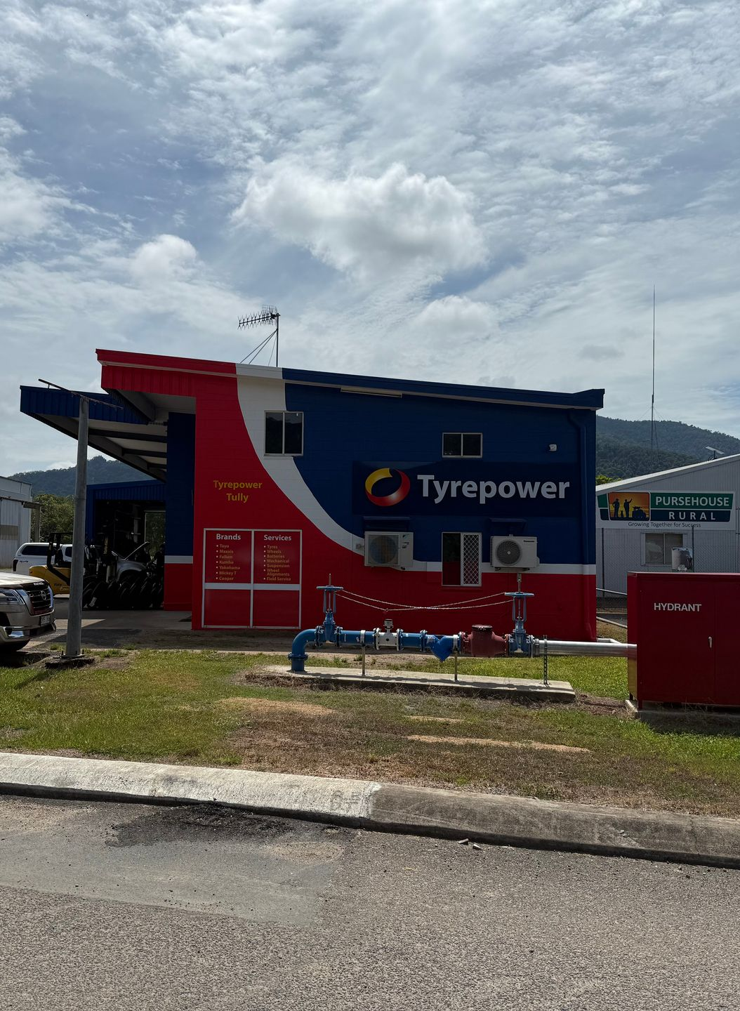 A Sign Is Out The Front Of A Good Year Tire Shop — Dore's Goodyear Autocare Tully In Tully, QLD