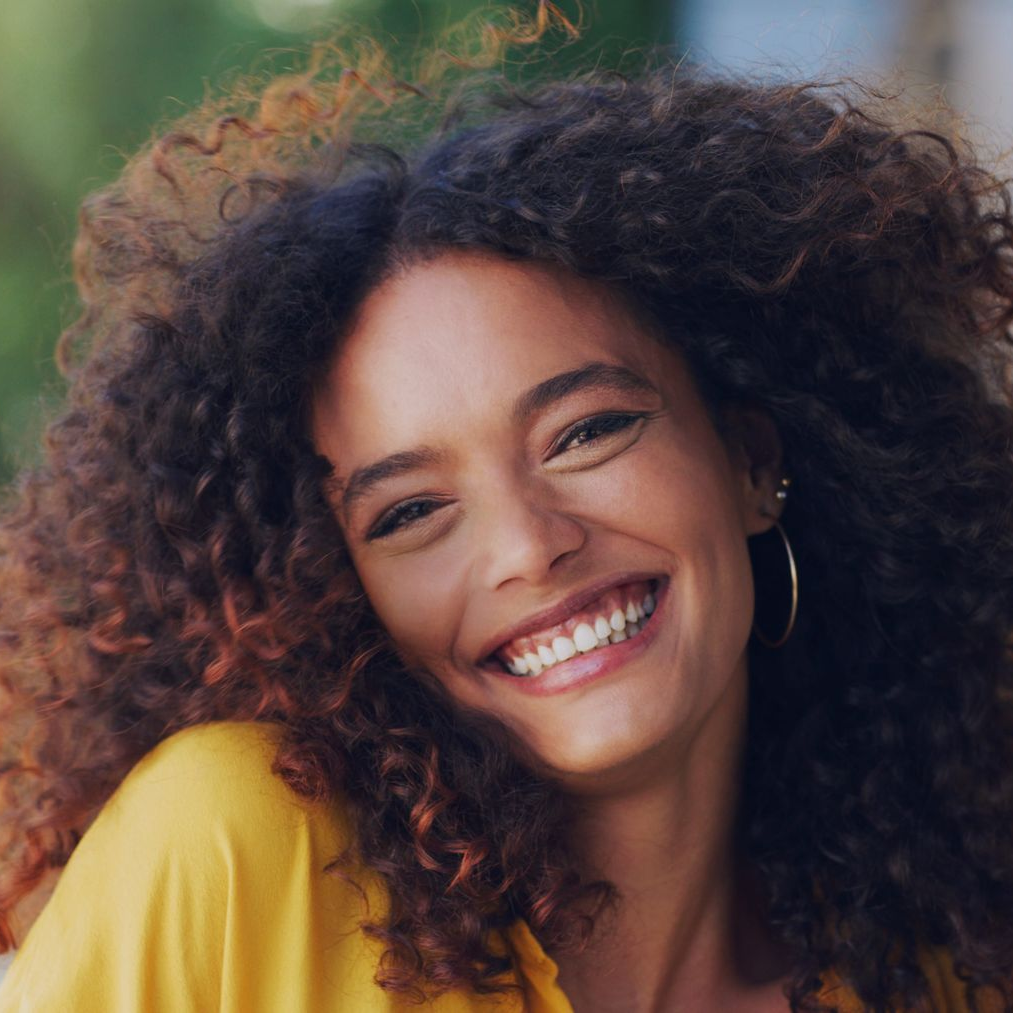 Therapist smiling at her client while having a conversation.