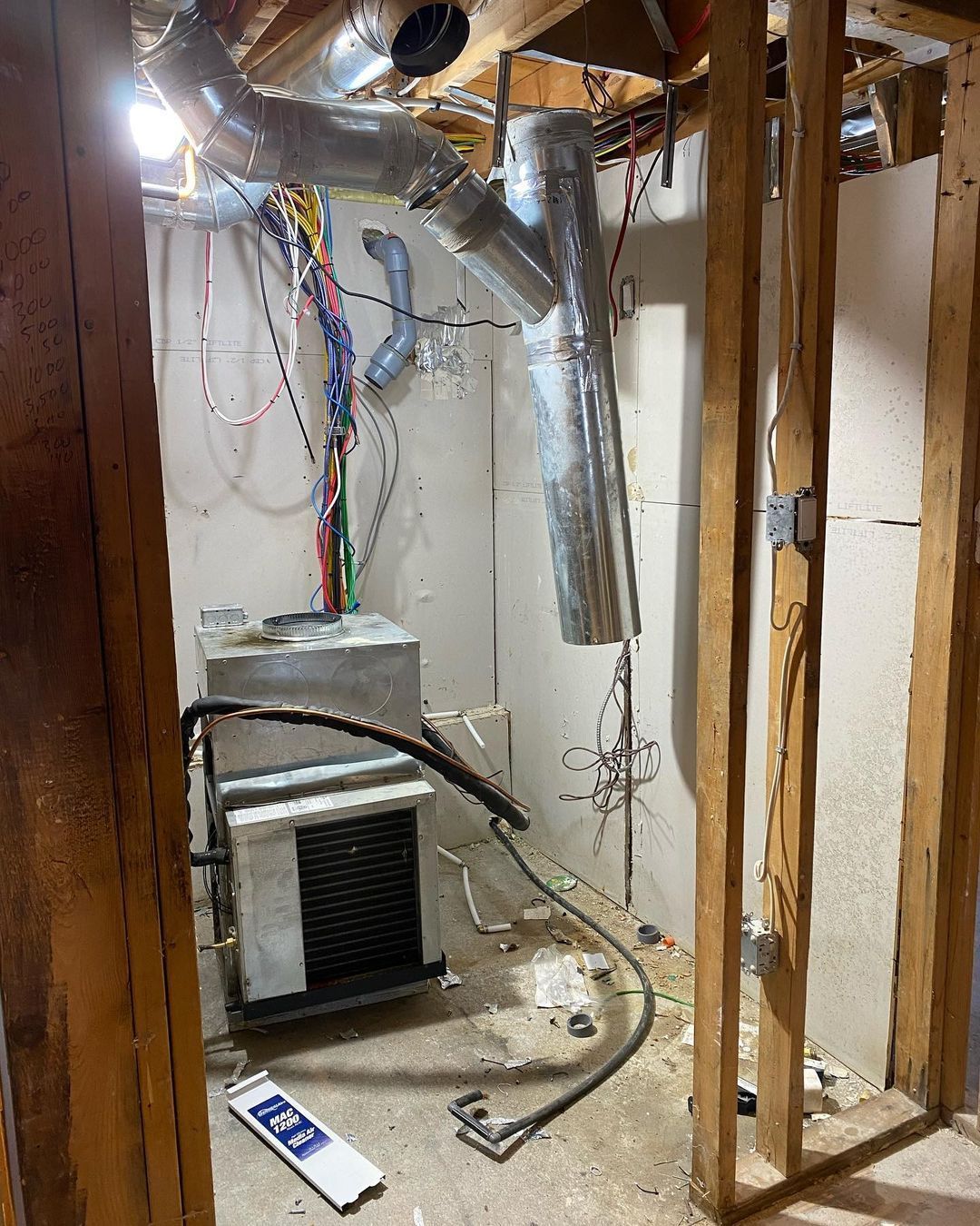 A room with a lot of wires hanging from the ceiling.