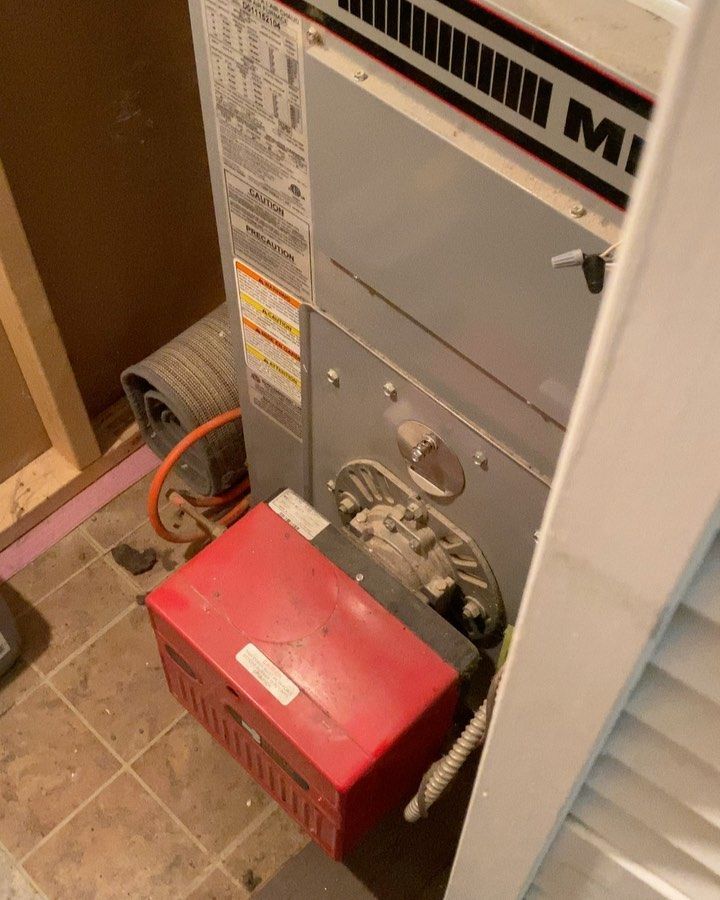A milwaukee heater is sitting on a tiled floor