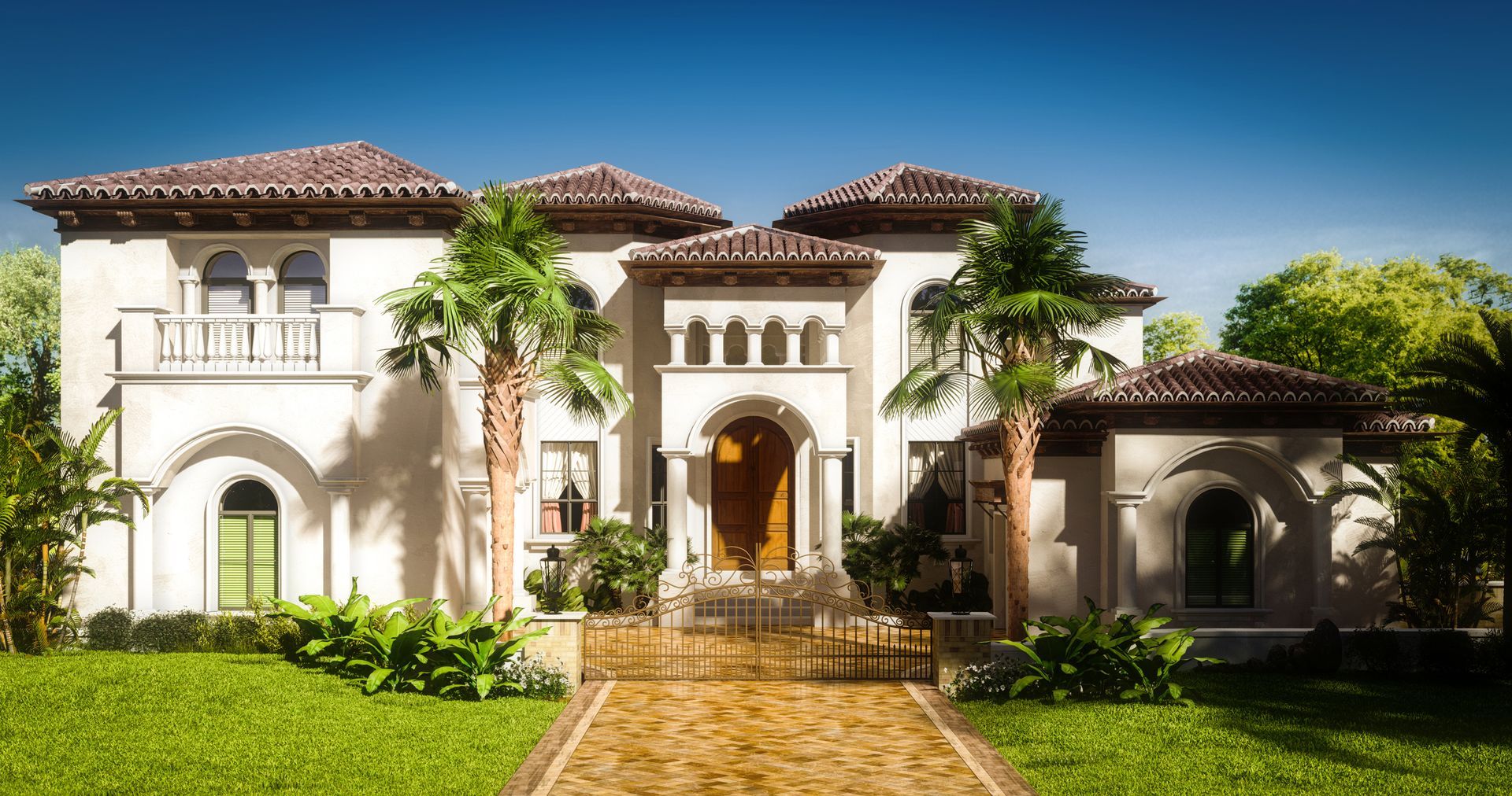 A large white house with a tiled roof and palm trees in front of it.