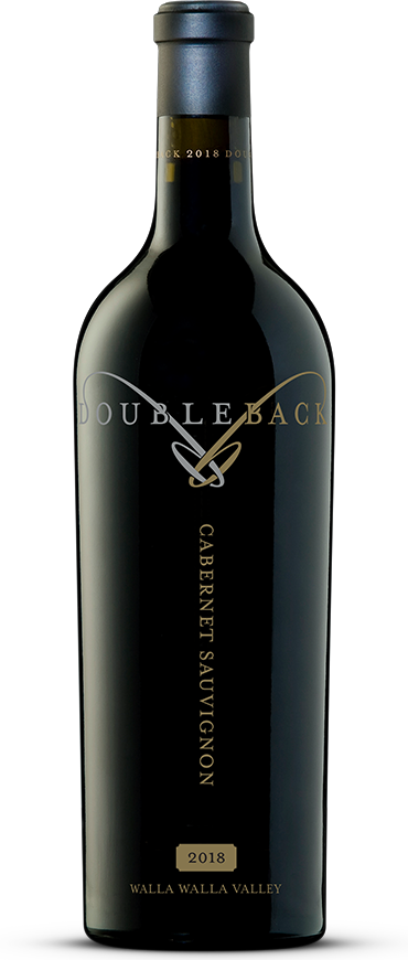 Black wine bottle with gold label text and dark glass, standing on a white background