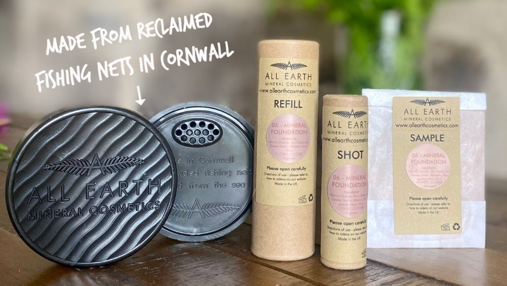 Mineral foundation pot and refills from All Earth Minerals on a wooden table.