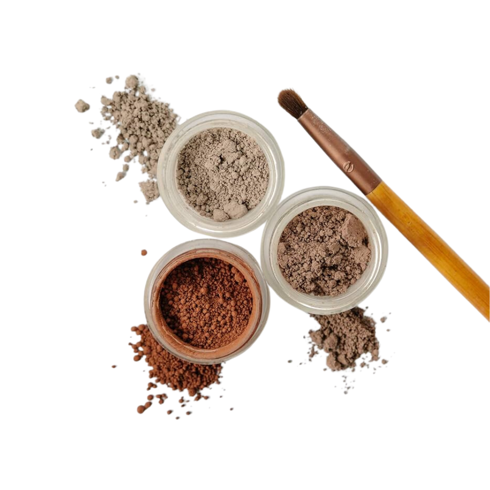 Three jars of honeypie minerals powder and a brush on a white background