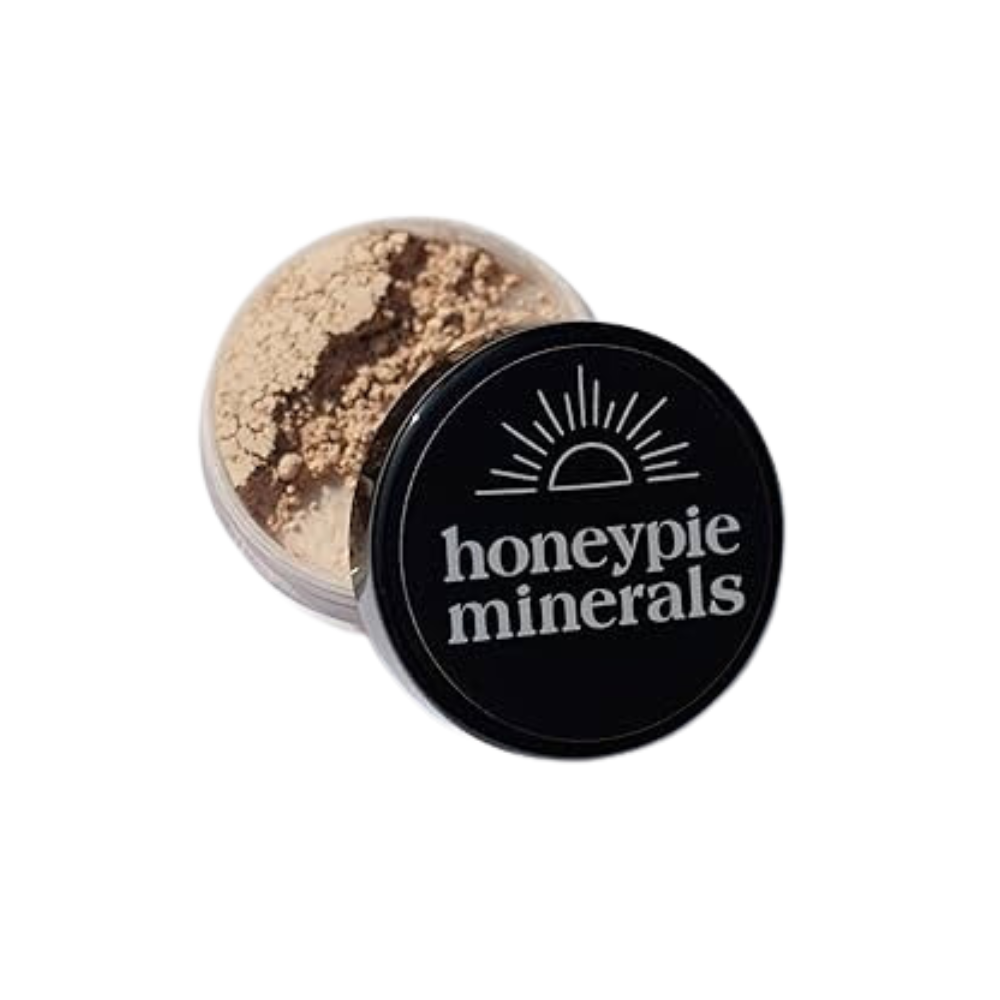 A jar of honeypie minerals powder on a white background