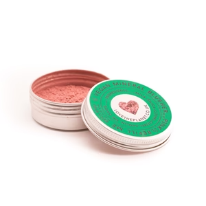 A tin with a heart on it that says love the planet