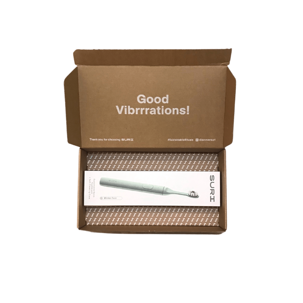 an electric toothbrush in a box that says good vibrarations