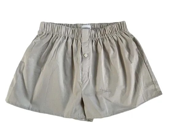 A pair of khaki boxer shorts on a white background