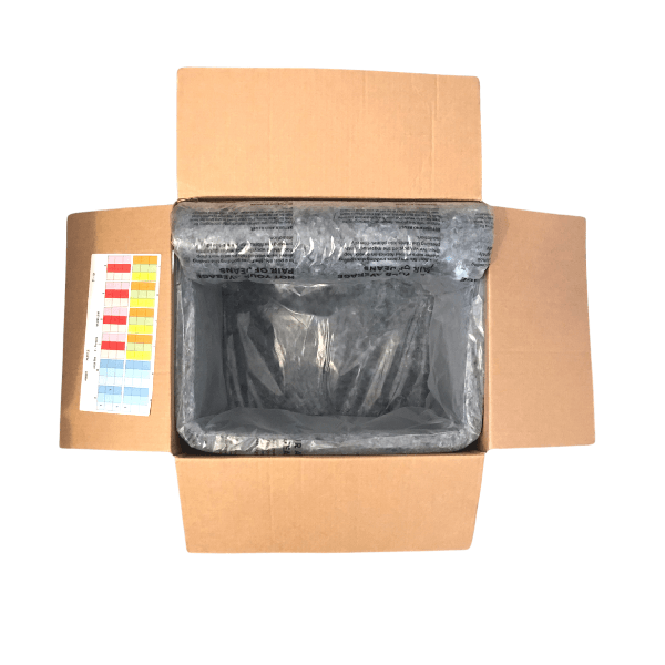 A cardboard box with a compostable bag and wool in it