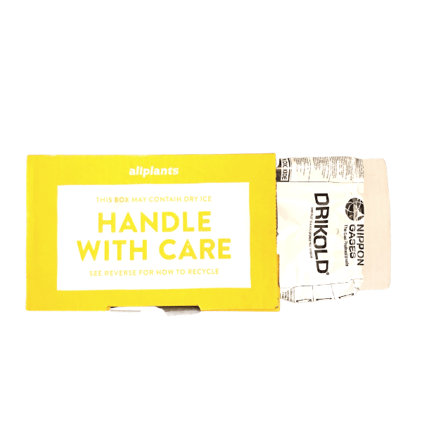 A yellow box that says handle with care on it