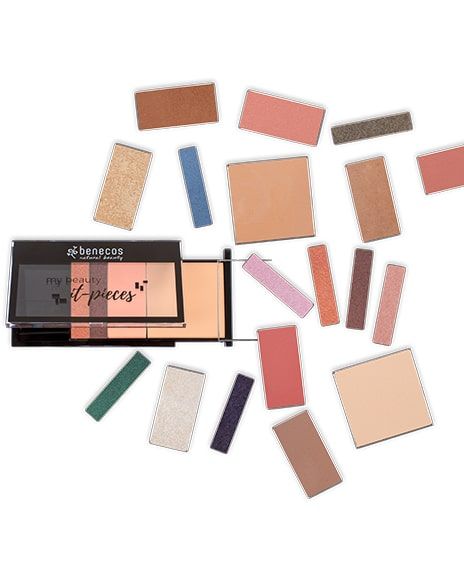 A palette of eye shadows is surrounded by smaller palettes