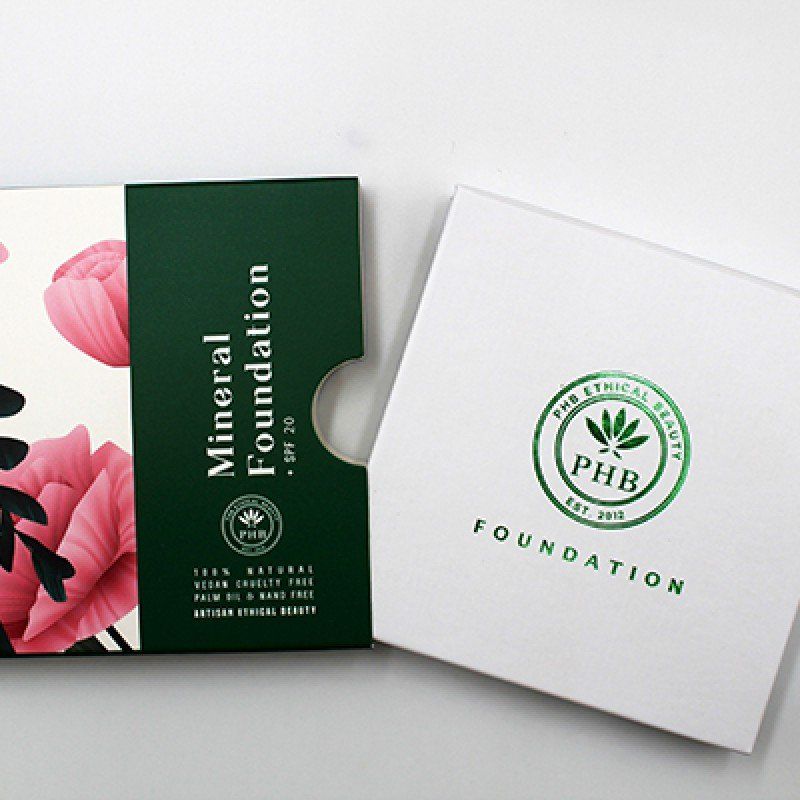 A box of mineral foundation sits next to a box of phb foundation
