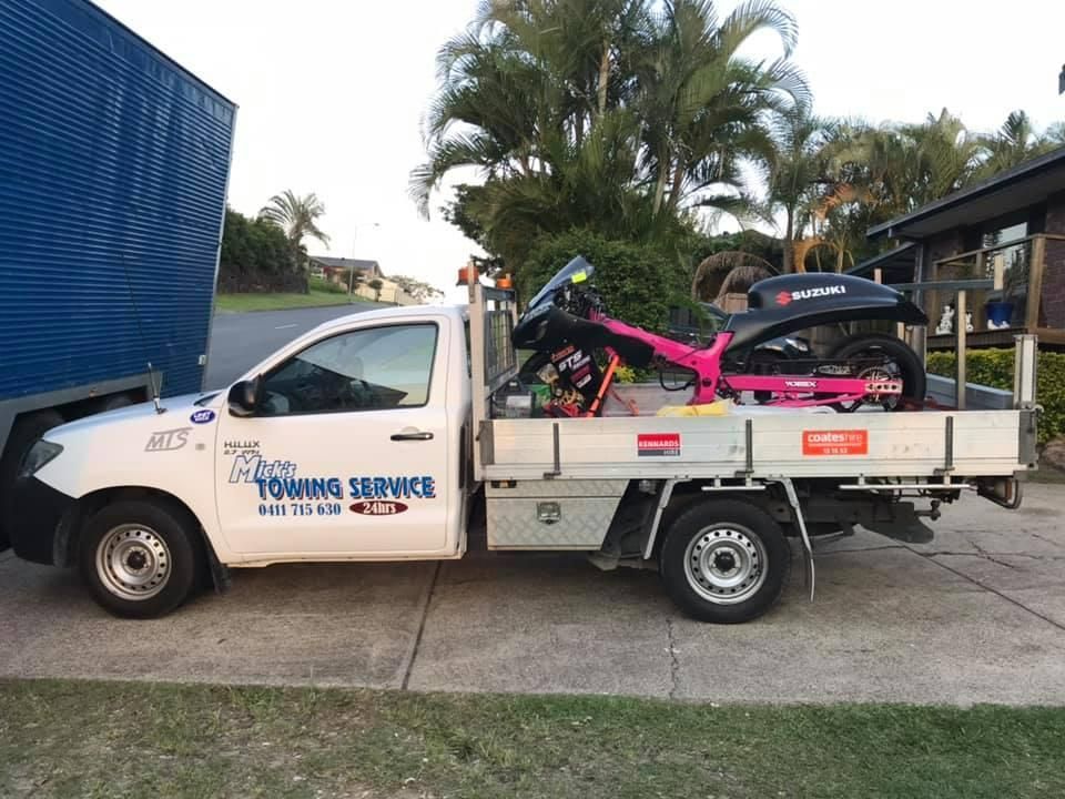 A Towing Service Truck with A Motorcycle in The Back — Mick's Towing Service Pty Ltd in Carrara, QLD