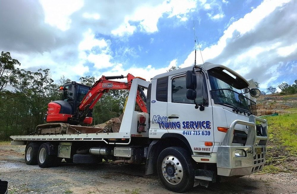 Two tow trucks from Mick's Towing Service on the Gold Coast