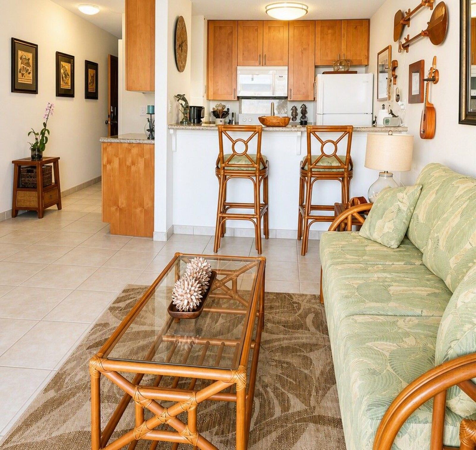 D24 living room with sofa, bar seating and kitchen