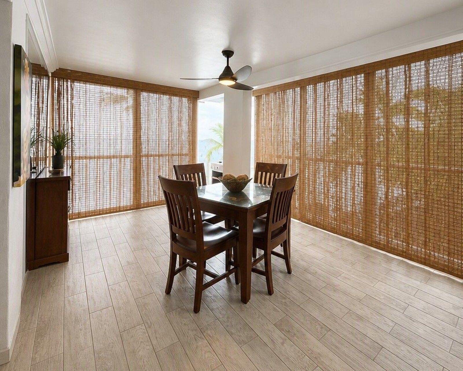 314 dining table and chairs with woven shades on the windows