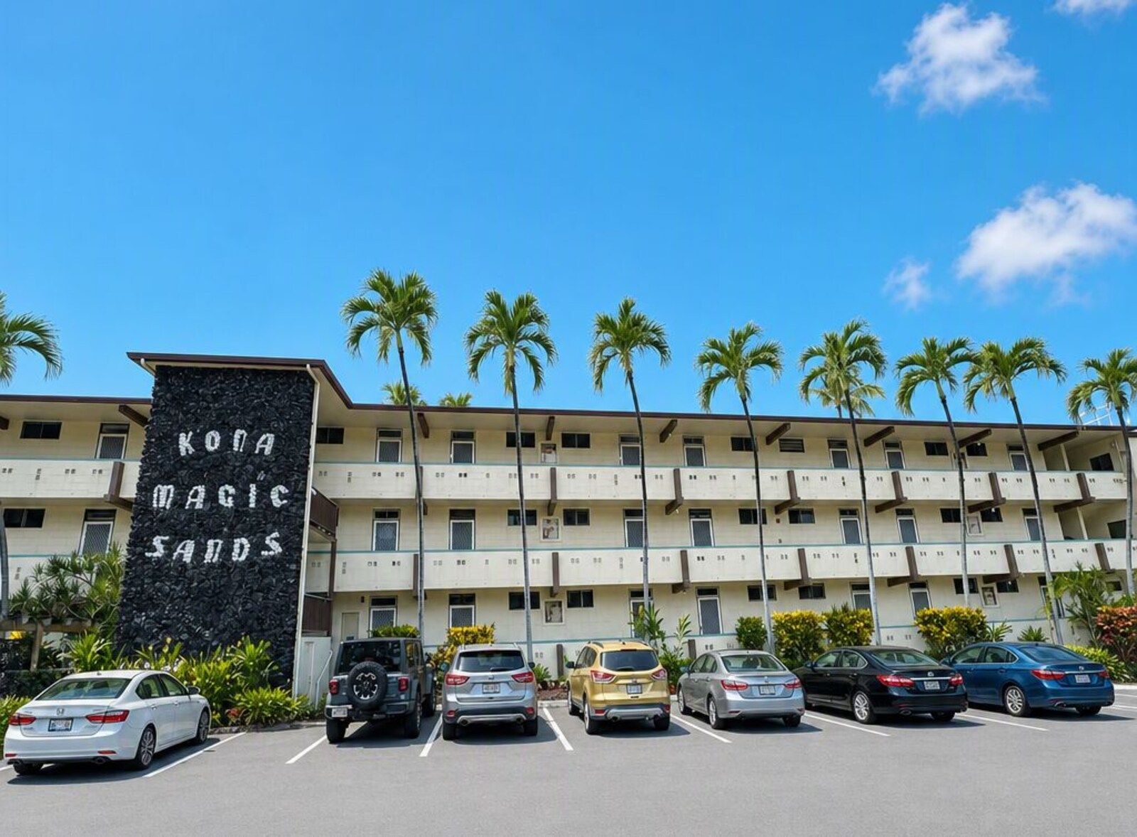 Kona Magic Sands building and parking from the street