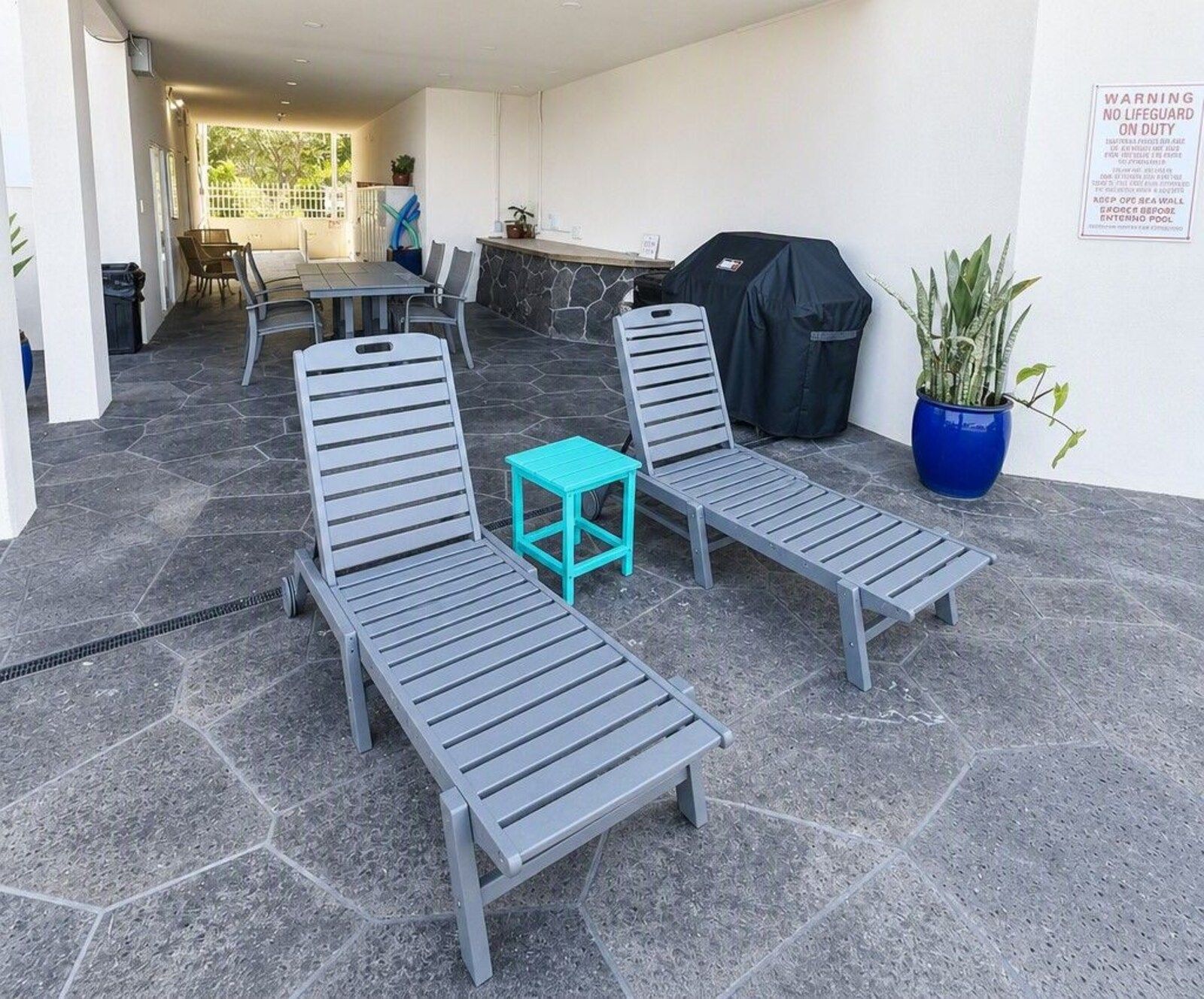 Covered picnic seating and BBQ grills at Kona Magic Sands