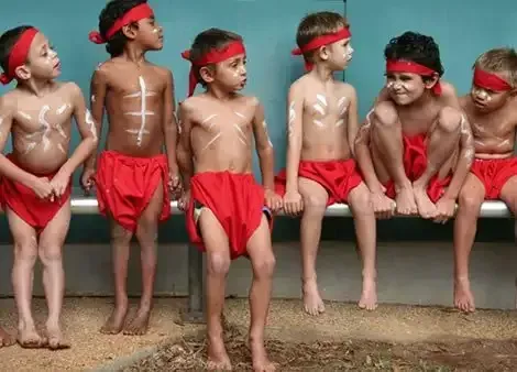 A Group of Little Children Wearing Red Shorts with White Paint in the Body — Northern Beaches GP Superclinic in Burdell, QLD