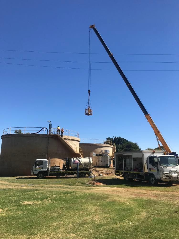 Tank Cleaning Using Heavy Machinery — Sav’s Plumbing in Mount Isa, QLD